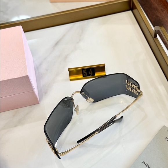 Miu Miu Style Rimless Gold Frame Black Sunglasses main image 8